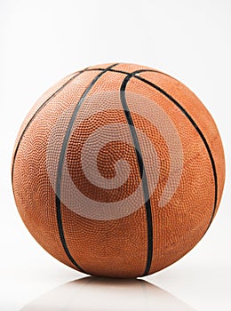 Basketball ball over white background. Orange ball, sports concept