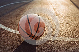 Basketball ball on urban court. Healthy lifestyle and sport concepts