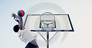 Basketball, black man and shooting in the net outside for athletic game and healthy lifestyle. Training, ball match and