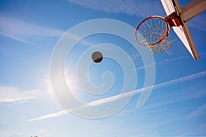 Basketball close up, basketball bal in hoop at sunny day