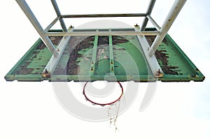 Basketball court  with old wood backboard.blue sky and white clouds on background. Old Basin Stadium,on white background