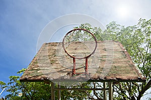 Basketball court  with old wood backboard.blue sky and white clouds on background. Old Basin Stadium,on white background,with