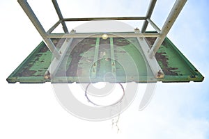 Basketball court  with old wood backboard.blue sky and white clouds on background. Old Basin Stadium,on white background