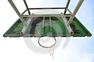 Basketball court  with old wood backboard.blue sky and white clouds on background. Old Basin Stadium,on white background