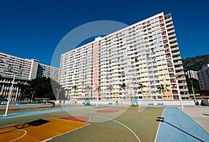 Basketball court and rainbow colored building facade in HongKong