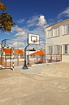 Basketball court in a schoolyard of a public primary school in holiday