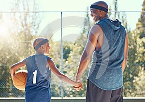 Basketball, family and sport with a dad and son training on a court outside for fitness and fun. Children, exercise and