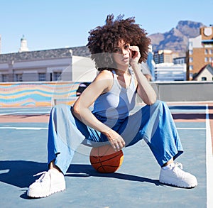 Basketball, fashion and portrait of black woman on court floor with trendy, urban style and edgy clothes in city. Sports