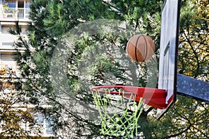 The basketball flies in rim or misses