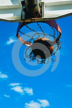 A basketball going in the net