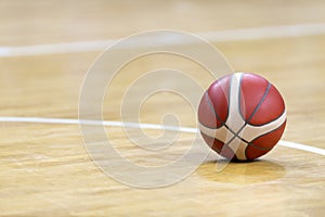 Basketball on hardwood court floor. Professional sport concept