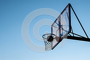 A basketball in a hoop