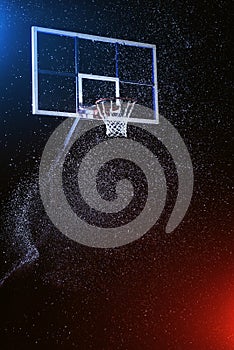 Basketball hoop on black. Basketball arena under rain. Lightened by mixed color lights.