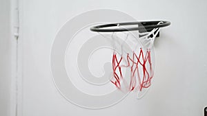 Basketball hoop on the door of the room. the basketball hits the basket. home games, recreation. successful hit on the target.