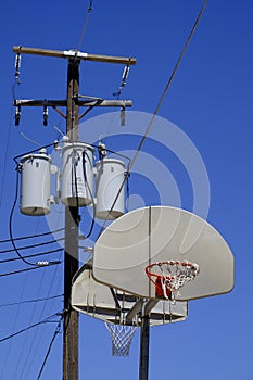 Basketball Hoop Innercity with Powerlines Close By