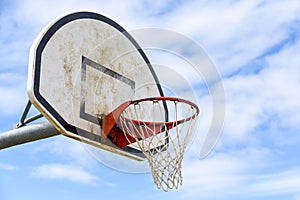 Basketball hoop with net on an outdoor basketball court