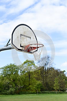 Basketball hoop with net on an outdoor basketball court