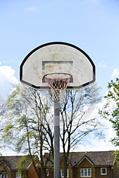 Basketball hoop with net on an outdoor basketball court