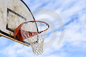 Basketball hoop with net on an outdoor basketball court