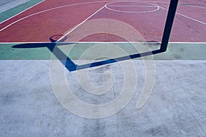 Basketball hoop shadow silhouette on the court on the street