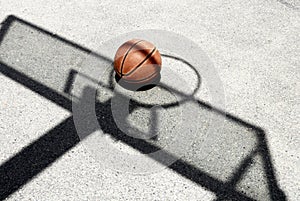 Basketball and hoop shadow