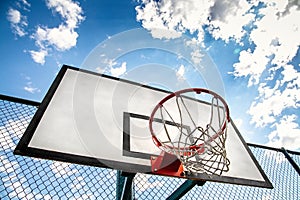Basketball hoop on a streetball court outdoor. Urban youth activity