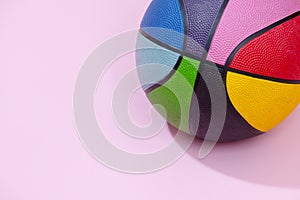 Basketball on pink background as a sports and fitness symbol of a team leisure activity playing with a leather ball dribbling and