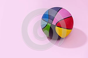 Basketball on pink background as a sports and fitness symbol of a team leisure activity playing with a leather ball dribbling and