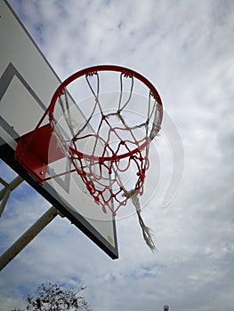 Basketball pitch in the field informing the dark sky. photo