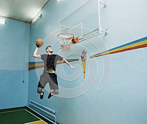 Basketball player in action in a basketball court