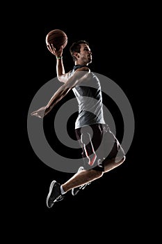Basketball player in action is flying high