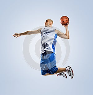 Basketball player in action isolated on white