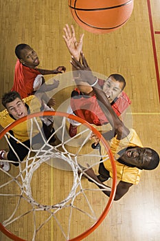 Basketball Player Attempting To Slam Dunk Ball