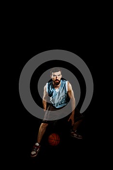 Basketball player dribbling a ball