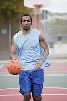 Basketball player dribbling the ball