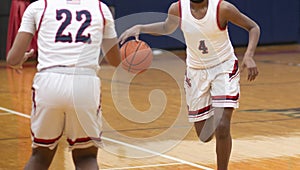 Basketball player dribbling ball during a game