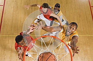 Basketball Player Dunking Basketball In Hoop