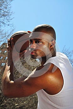 Basketball player guarding ball