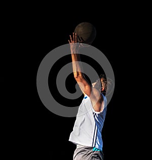 Basketball player isolated on black