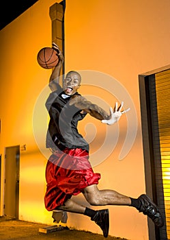 Basketball player jumps with ball