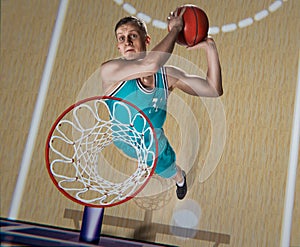 Basketball player making slam dunk on basketball arena