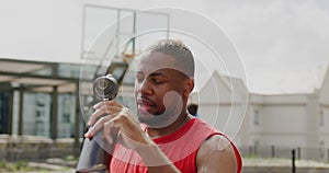Basketball player pouring water on head 4k