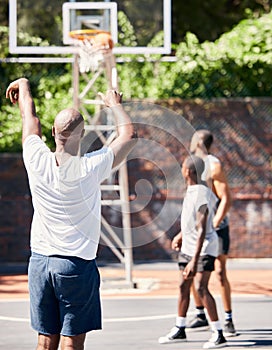 Basketball player, score and point in sports game for goal, victory or winning throw at the court outdoors. Man in