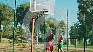 Basketball player scoring point with bank shot