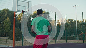 Basketball player shooting for field goals outdoor