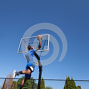 Basketball Player Slam Dunking