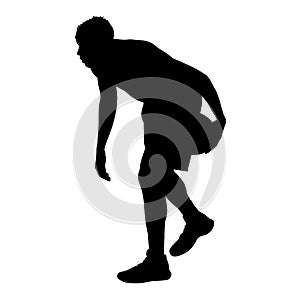 Basketball player standing and dribbling