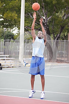 Basketball player taking the shot