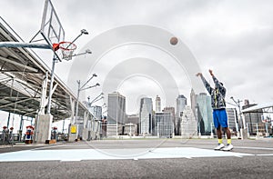 Basketball player training shots on the court