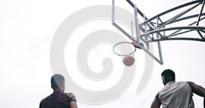 Basketball player winning sports game on court, playing in sport competition and training for exercise with friends
